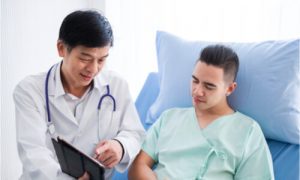 The doctor explains the treatment for colon cancer.